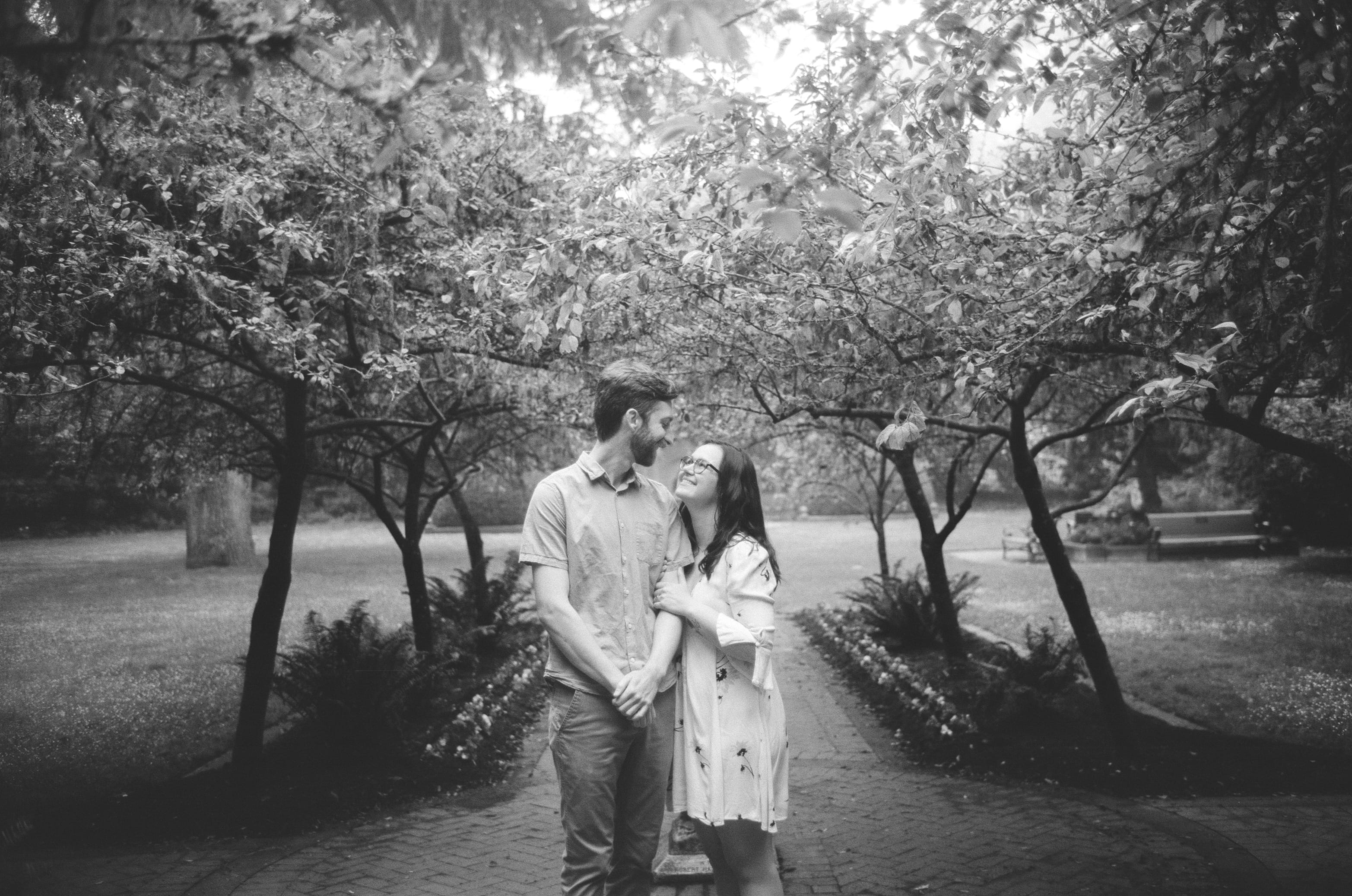 Julie and Ryan standing in a snowy forest.